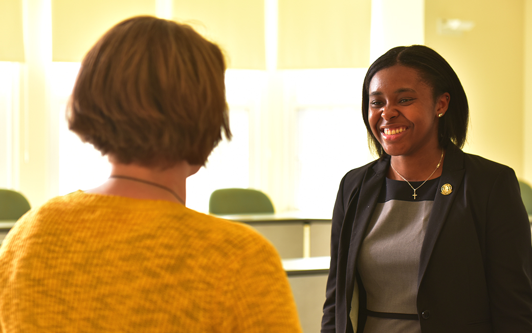 Accounting student and KPMG intern Breonna Myers talks to a professor Accounting student and KPMG intern Breonna Myers talks to a professor