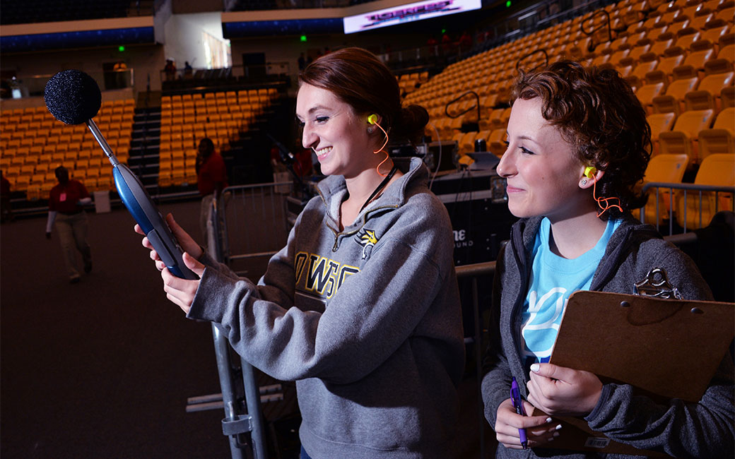 Audiology students testing equipment