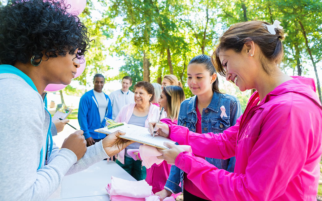 People signing up for a charity race
