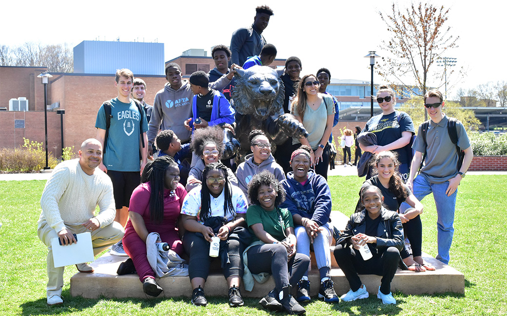 group of students with tiger statue