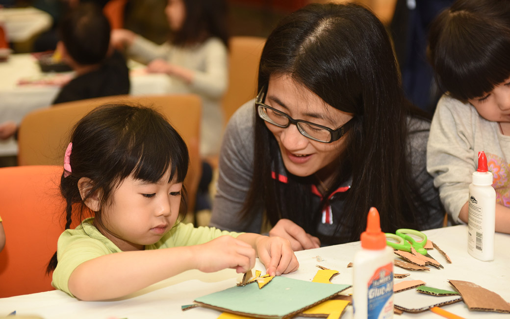 Mother with child making art