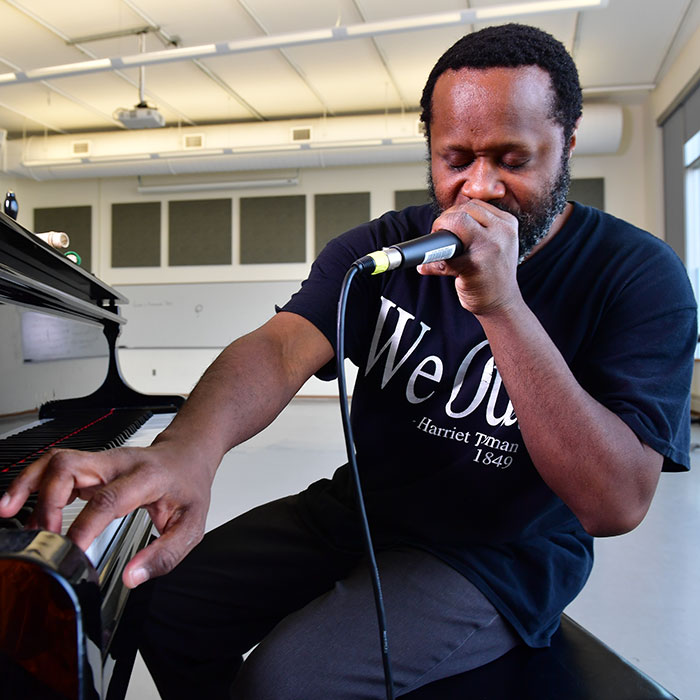 Shodekeh at piano