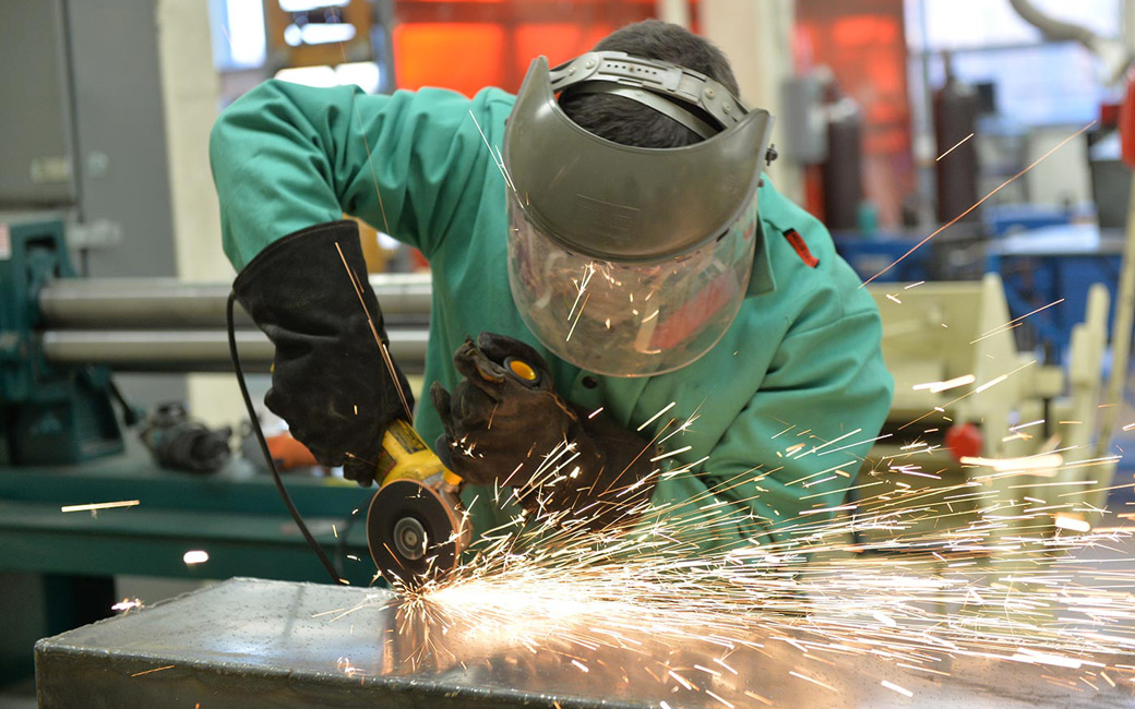 Student fabricating metal sculpture