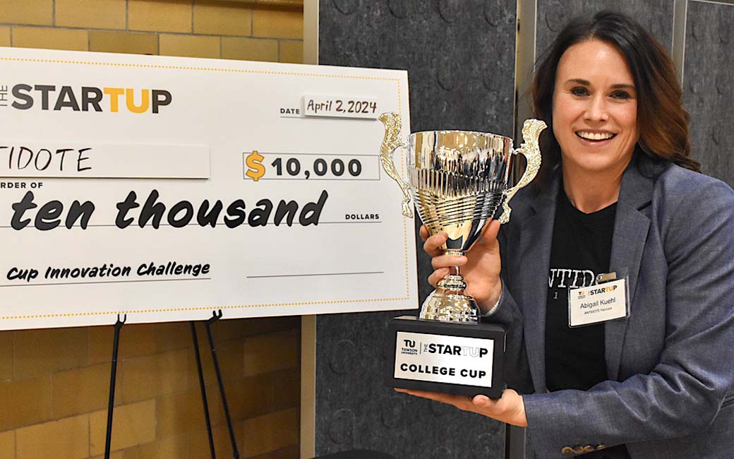 TU College of Business and Economics student Abigail Kuehl with College Cup awards