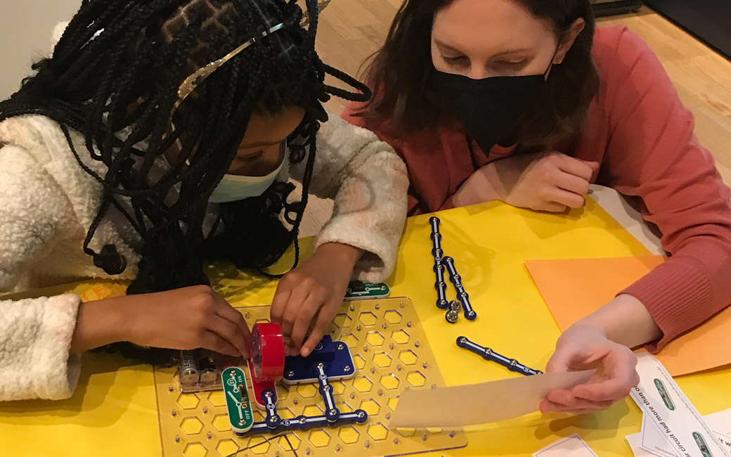 girl and teacher in circuits lab