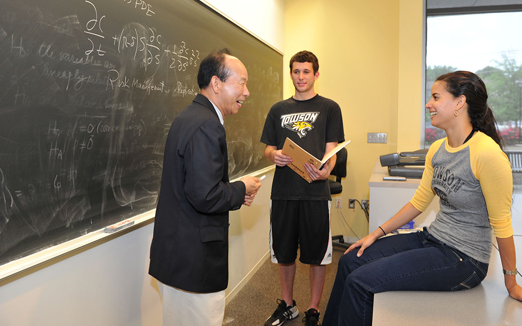 professor with two students