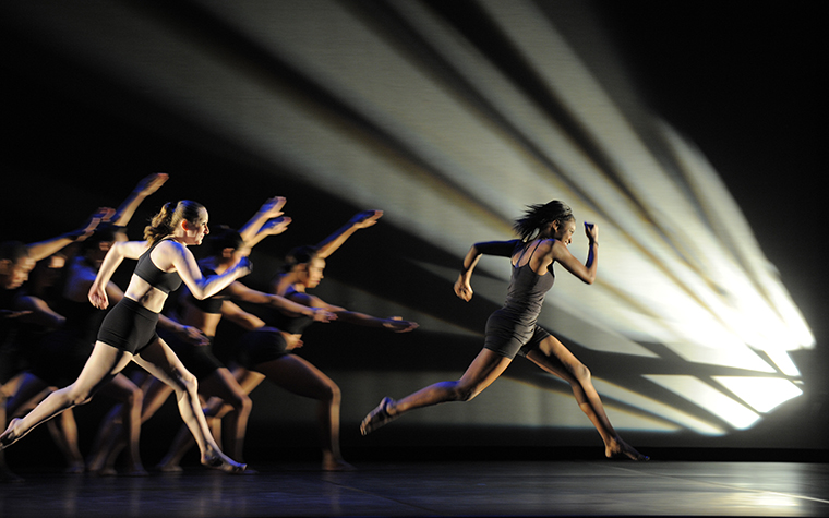 Femal dancer leading troupe 