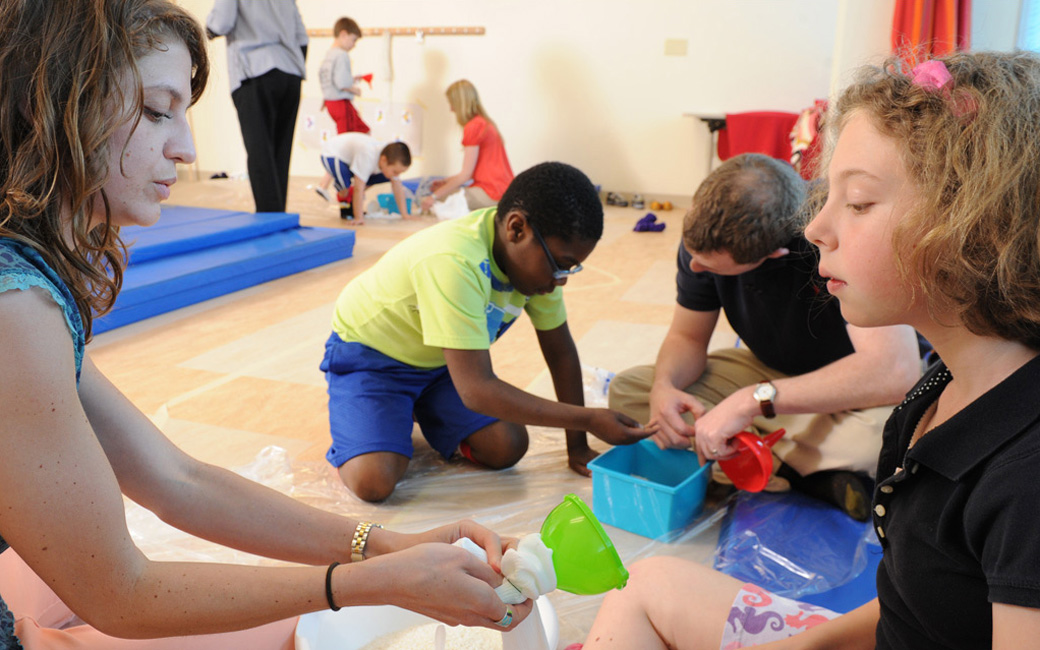 student and child interacting