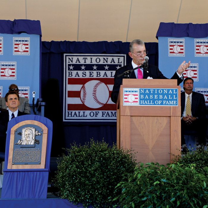 John Schuerholz talking at podium