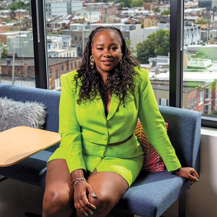 Tonee Lawson sitting on a couch in her office