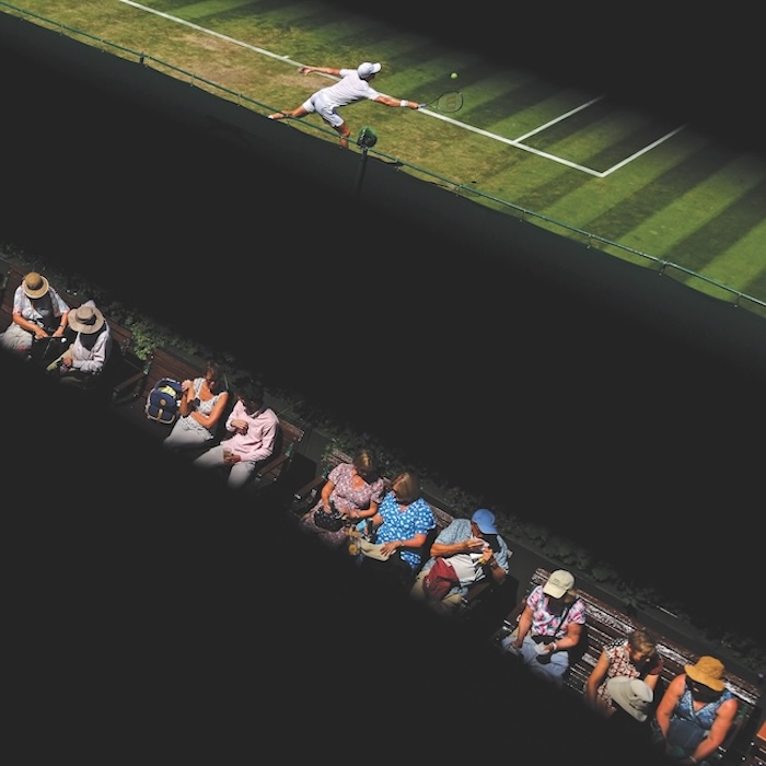 Crowd and player at Wimbledon separated by black lines