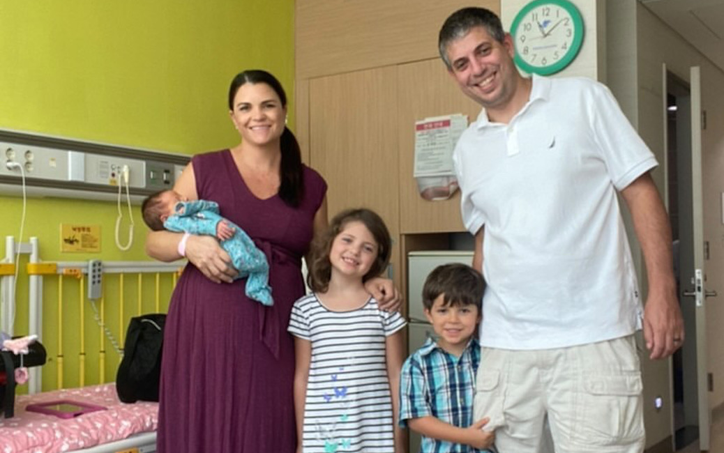 Megan, Neil, Lauren, Max and Emma Eller in a hospital room