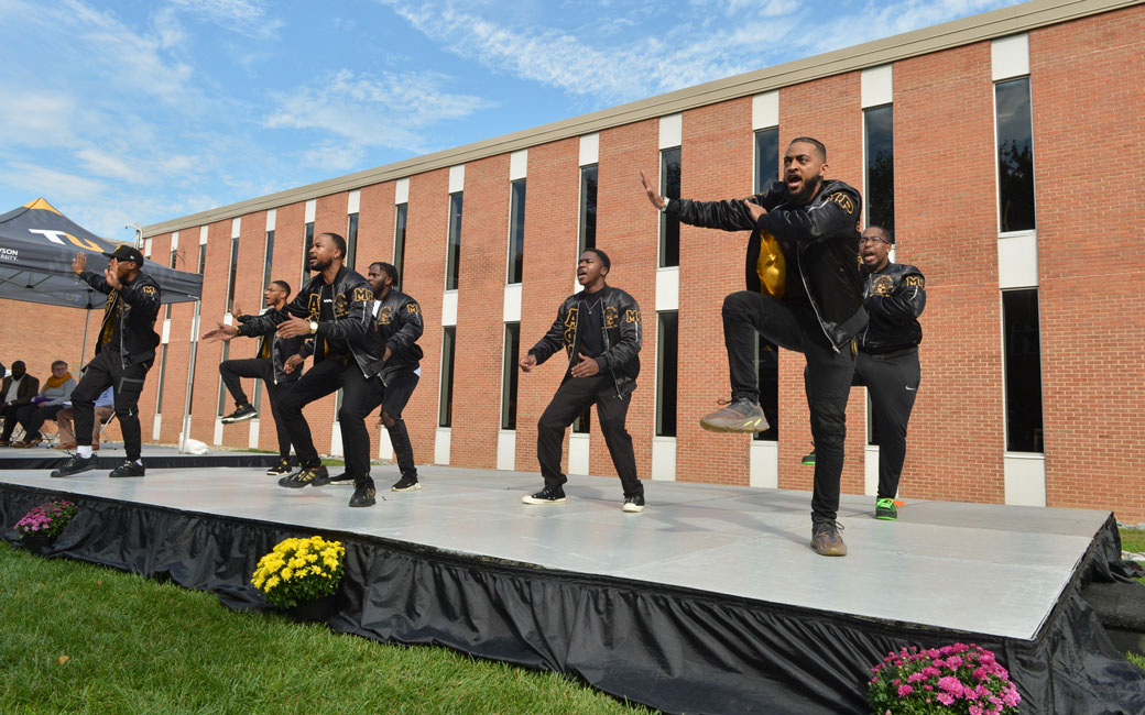 Members of Alpha Phi Alpha peform during the Chapman Quad dedication