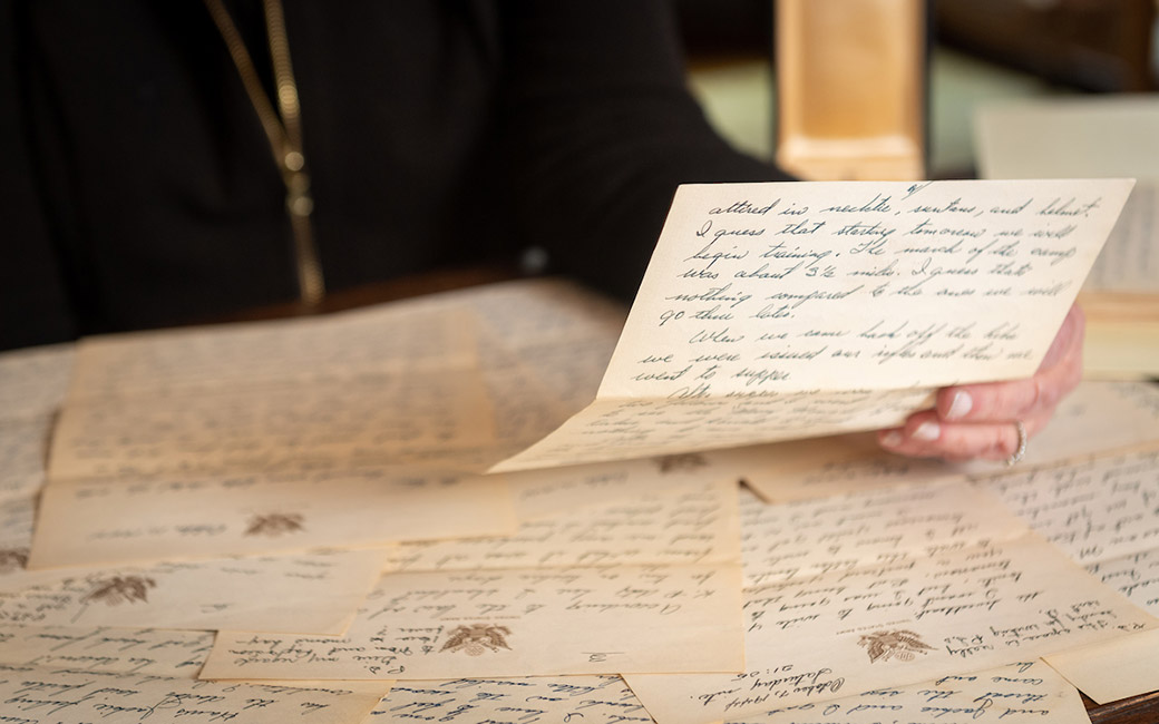 Detail shot of hands holding handwritten letter