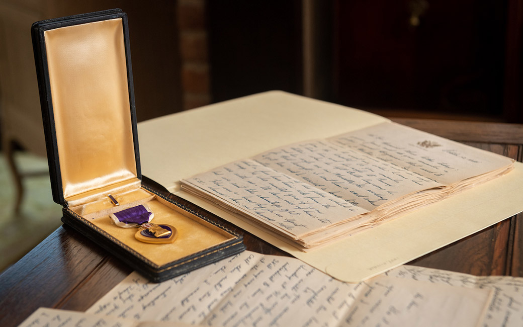 Detail shot of hands holding handwritten letter