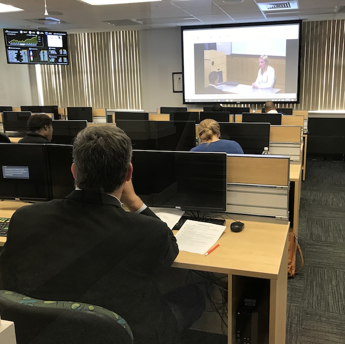 Sales professionals judged students' pitches via a closed-circuit video feed. Sales professionals judged students' pitches via a closed-circuit video feed.