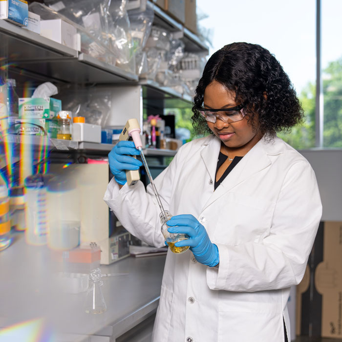 Victoria Akingbehin working in the lab