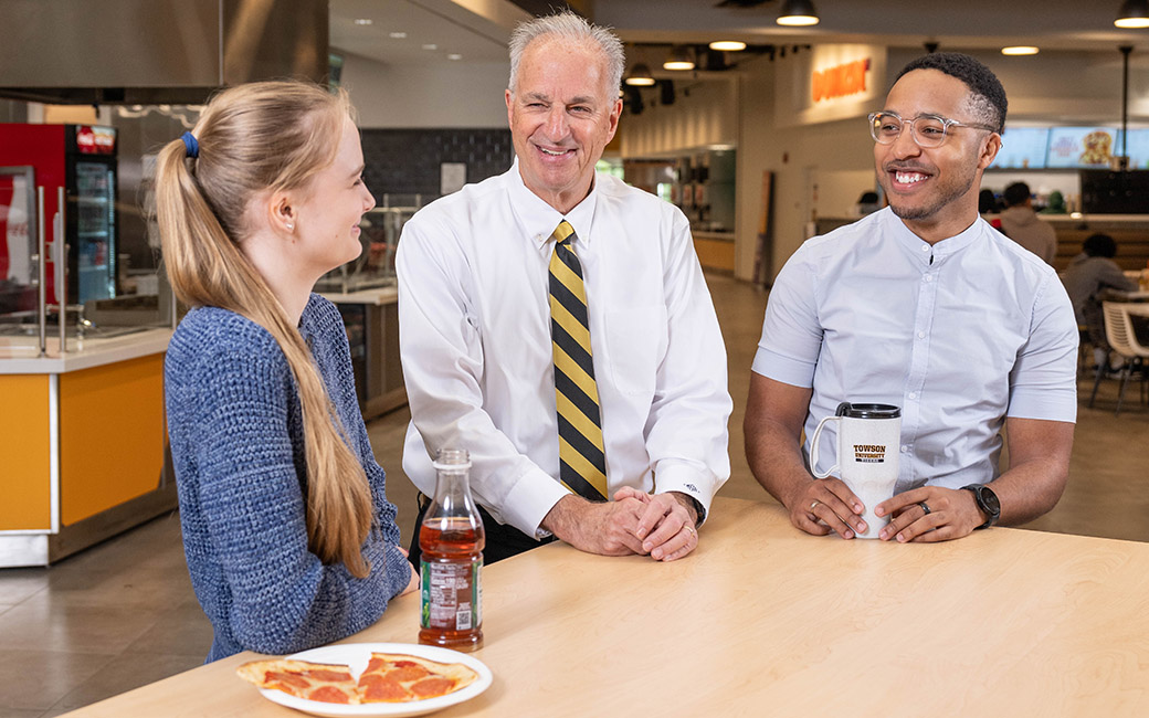 TU President Ginsberg eating lunch with students