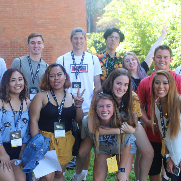 Orientation group smiling at camera
