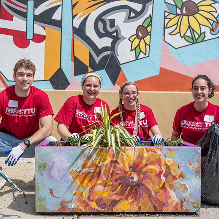 students doing community service at impactTU