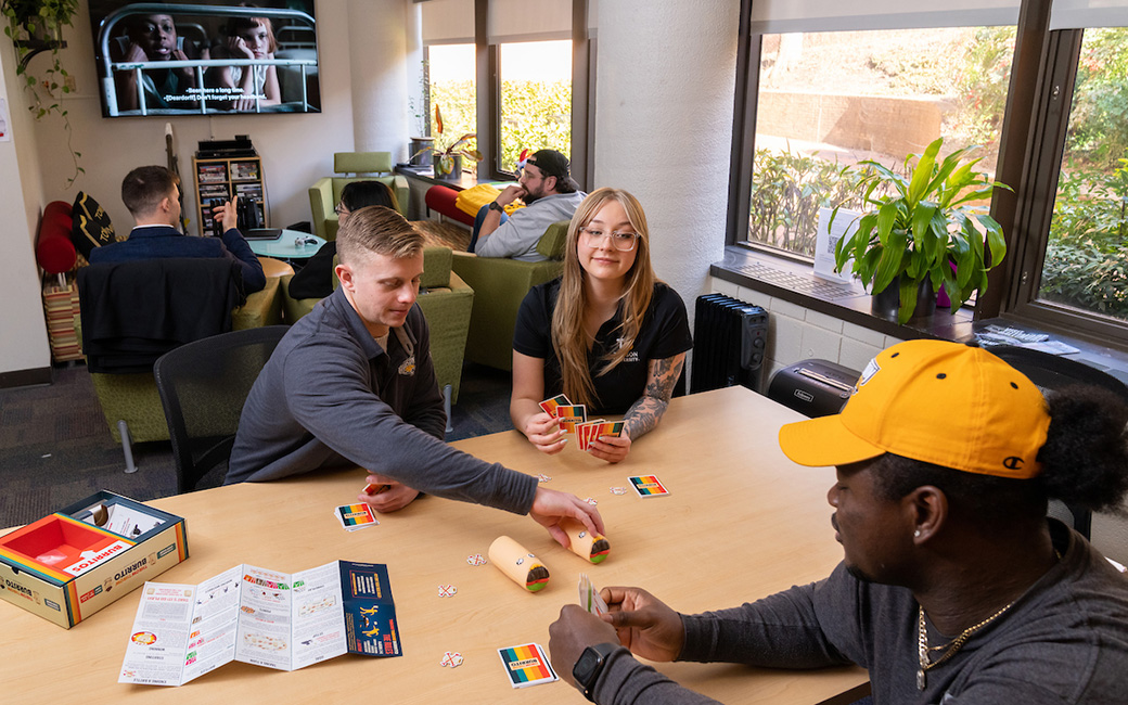 TU veteran students playing a card game